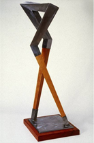 Capricorn - cherry wood and steel base: 18” x 24” height: 32”